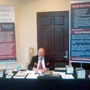 Bob Armstrong helps at our literature table at The Awakening