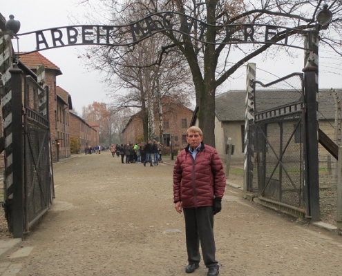 William J. Murray at the gate of Auschwitz which read "Work makes freedom," but the only freedom those who entered ever received was death.