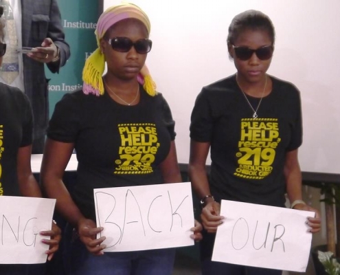 Young Christian women display signs asking for the return of their sisters kidnapped by the Boko Haram