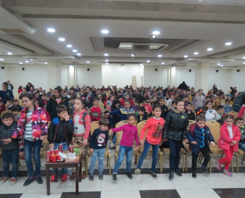 Nearly 300 Iraqi and Syrian Christian refugee children play a game similar to "Simon says" during a Christmas celebration in Amman. Christmas, 2017
