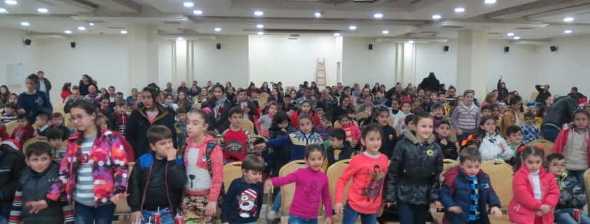 Nearly 300 Iraqi and Syrian Christian refugee children play a game similar to "Simon says" during a Christmas celebration in Amman. Christmas, 2017