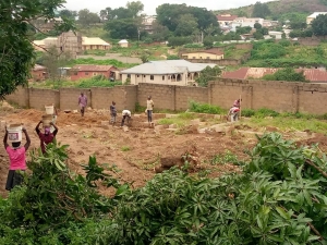 Staff and volunteers are working tirelessly to clear and prepare the land for renovations in order to get the children into the compound as soon as possible.