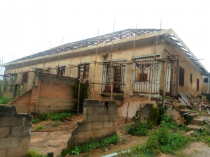 A new roof and structural supports are being added to the boy's dormitory to make it livable.